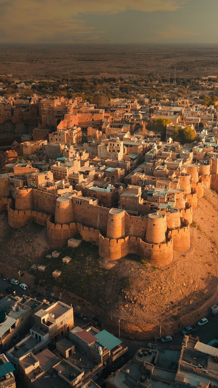 A majestic view of Jaisalmer Fort Rajasthan, a historic sandstone fortification in Rajasthan, featuring its intricate architecture and surrounding desert landscape."